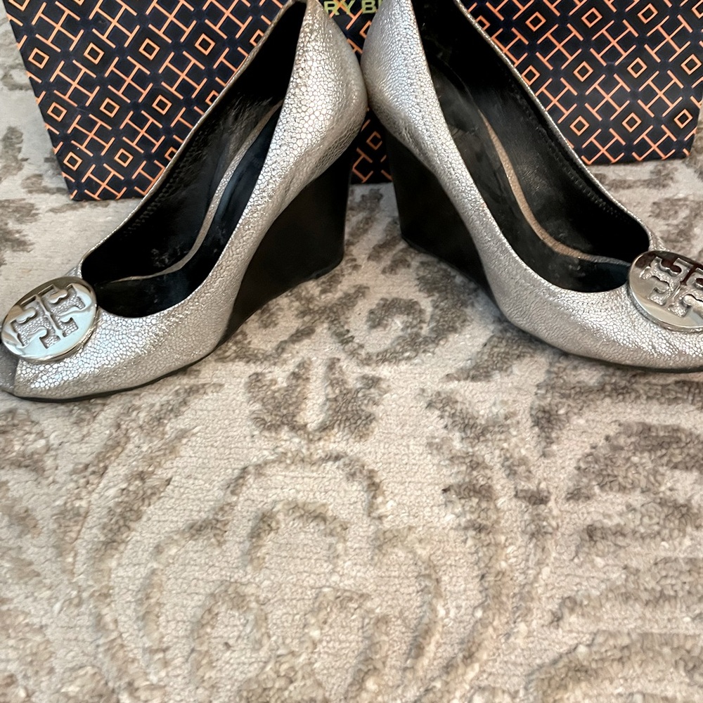 Tory Burch silver metallic wedges.